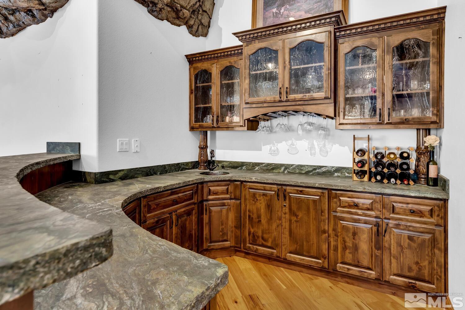 3100 Yellow Tail Road Reno, NV 89510 - Photo 19 of 40 a kitchen with granite countertop a sink and cabinets