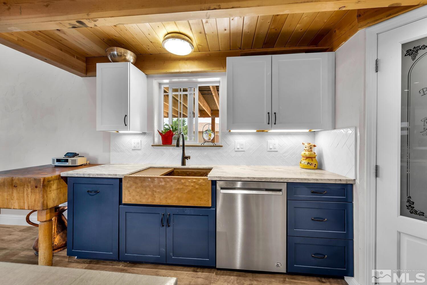 3100 Yellow Tail Road Reno, NV 89510 - Photo 26 of 40 a kitchen with granite countertop wooden cabinets and a sink