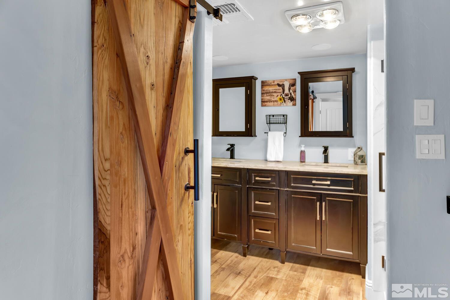 3100 Yellow Tail Road Reno, NV 89510 - Photo 31 of 40 a bathroom with a sink a vanity and a mirror