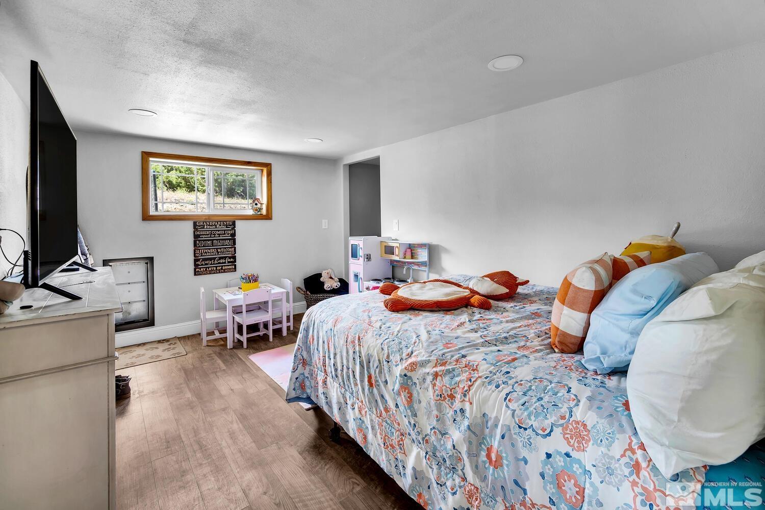 3100 Yellow Tail Road Reno, NV 89510 - Photo 33 of 40 a bedroom with bed and a flat screen tv