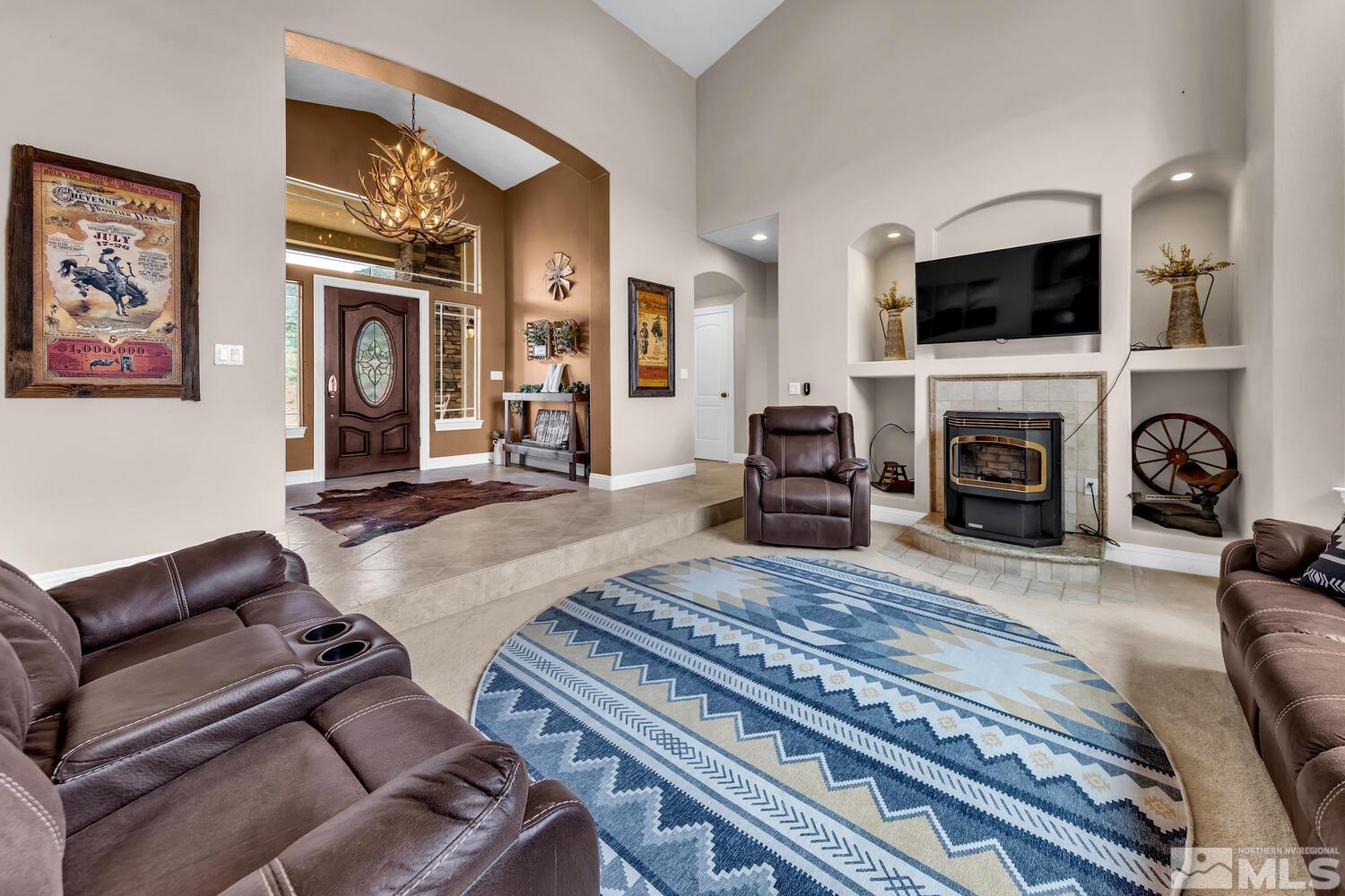 3100 Yellow Tail Road Reno, NV 89510 - Photo 4 of 40 a living room with furniture and a fireplace