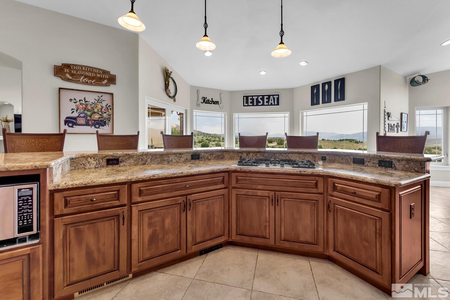 3100 Yellow Tail Road Reno, NV 89510 - Photo 6 of 40 a kitchen with granite countertop a sink and cabinets