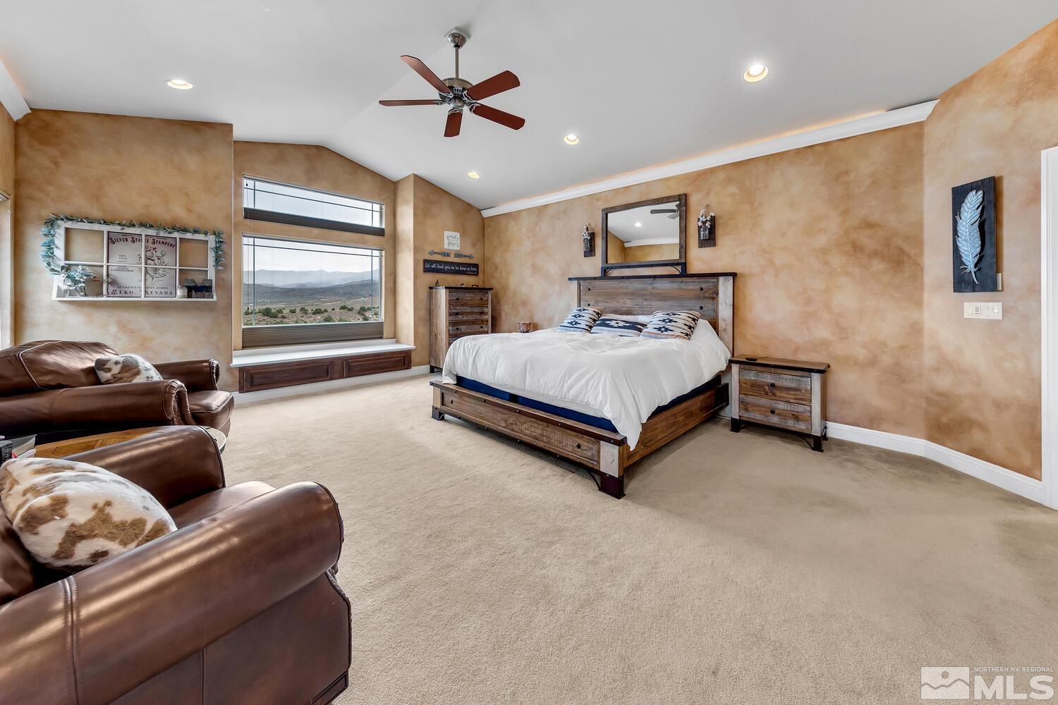 3100 Yellow Tail Road Reno, NV 89510 - Photo 9 of 40 a spacious bedroom with a bed and a couch