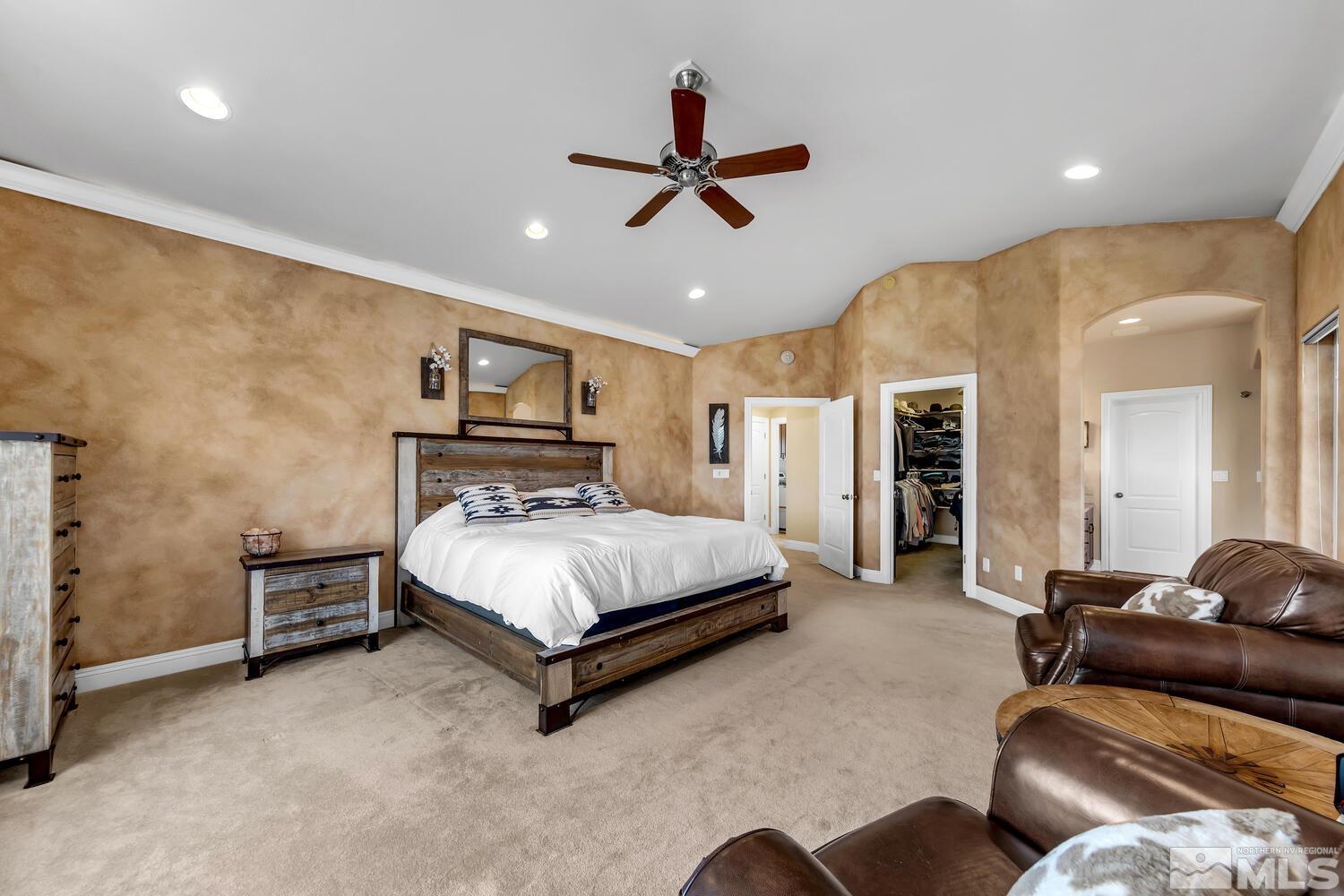 3100 Yellow Tail Road Reno, NV 89510 - Photo 10 of 40 a bedroom with a bed and ceiling fan