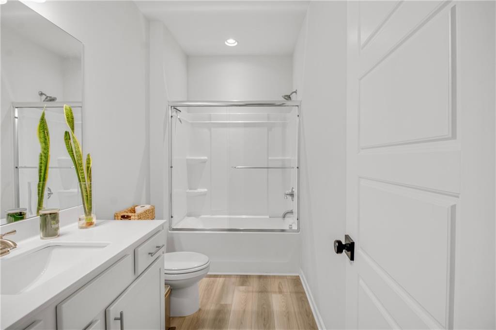 338 Ryston Way Grayson, GA 30017 - Photo 11 of 61 a bathroom with a sink a toilet and shower