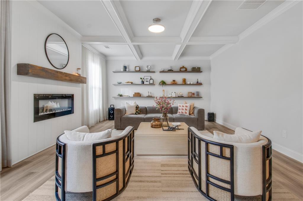 338 Ryston Way Grayson, GA 30017 - Photo 13 of 61 a living room with furniture a flat screen tv and a fireplace
