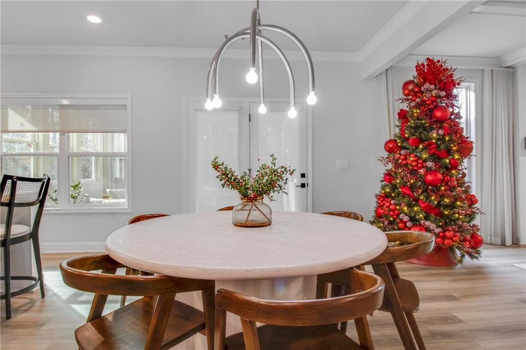 338 Ryston Way Grayson, GA 30017 - Photo 17 of 61 a view of a dining room with furniture and wooden floor