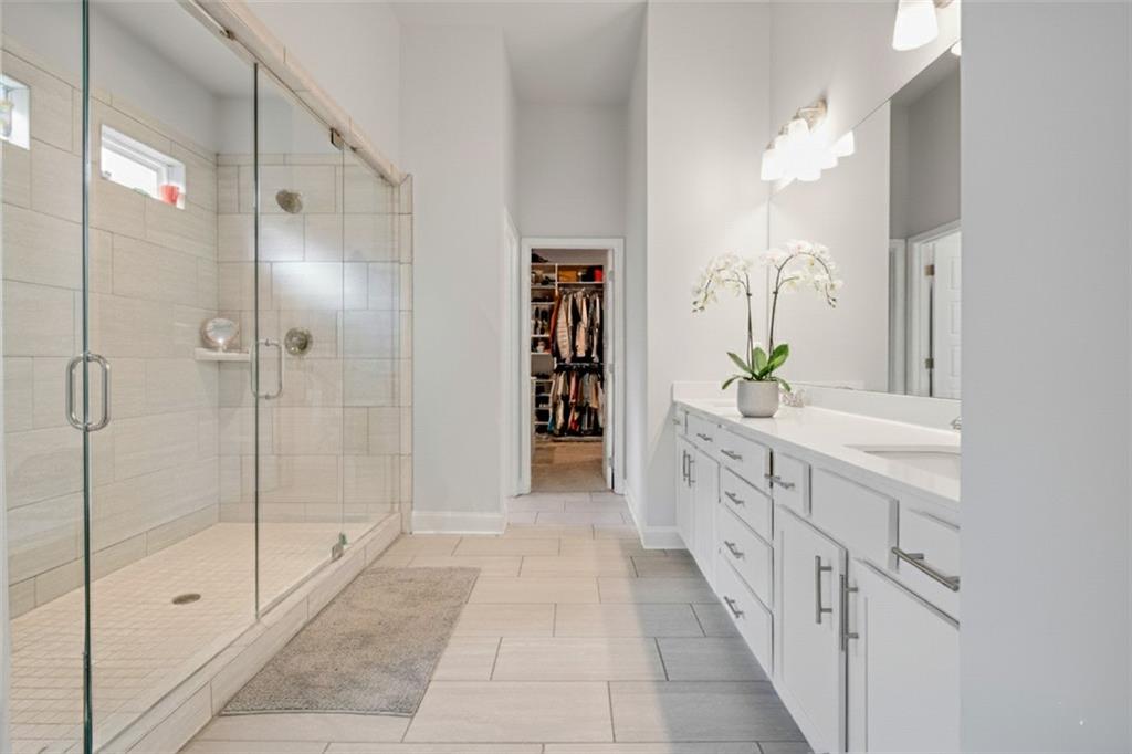 338 Ryston Way Grayson, GA 30017 - Photo 26 of 61 a bathroom with a double vanity sink and shower