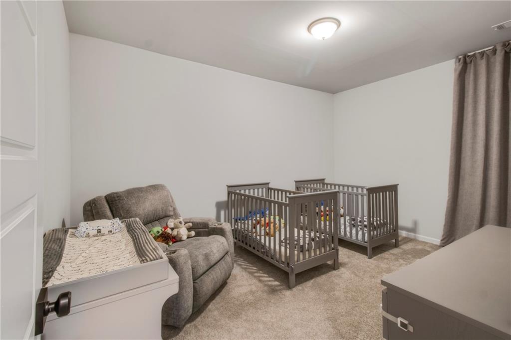 338 Ryston Way Grayson, GA 30017 - Photo 31 of 61 a bedroom with furniture and a window