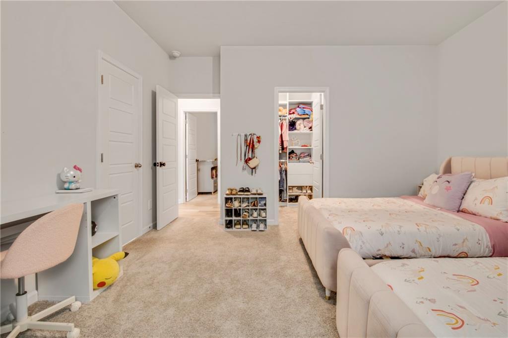 338 Ryston Way Grayson, GA 30017 - Photo 35 of 61 a bedroom with a bed and furniture