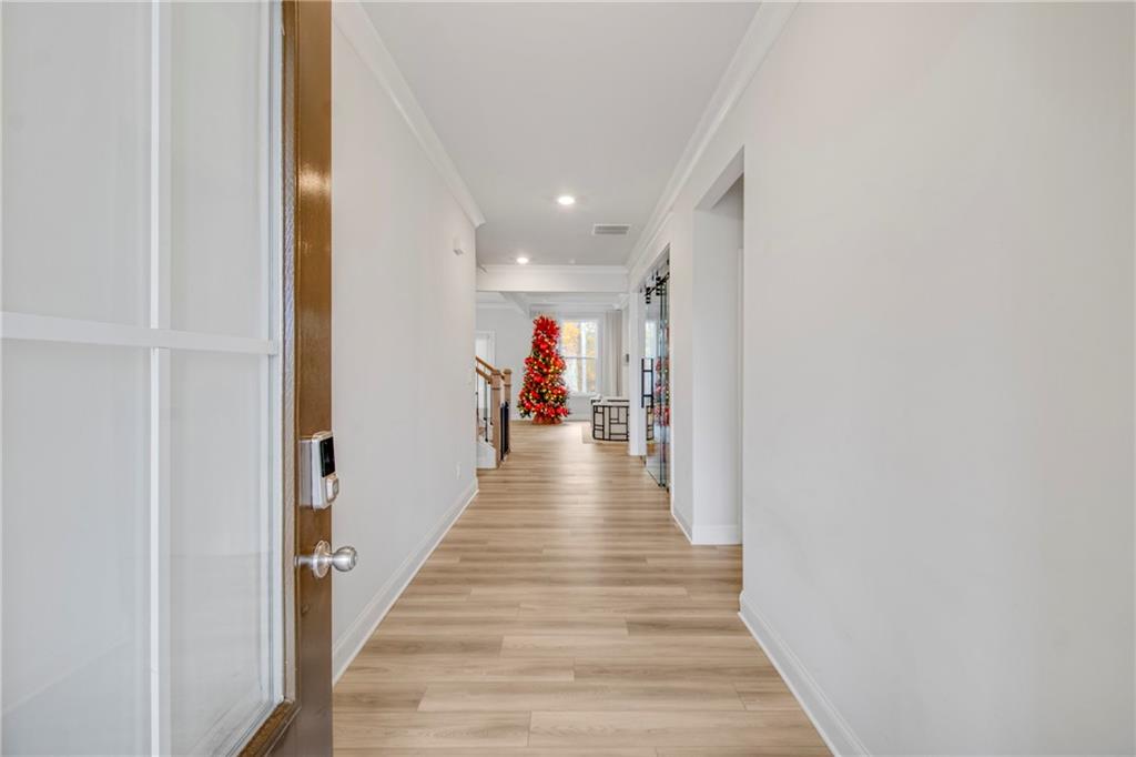 338 Ryston Way Grayson, GA 30017 - Photo 5 of 61 a view of a hallway with wooden floor