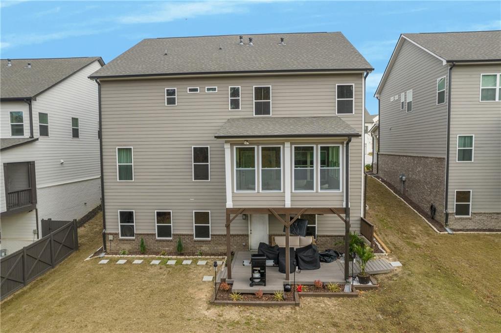 338 Ryston Way Grayson, GA 30017 - Photo 55 of 61 a front view of a house with large windows