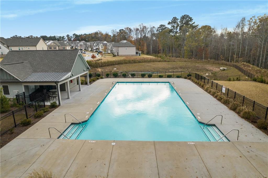 338 Ryston Way Grayson, GA 30017 - Photo 57 of 61 a view of a swimming pool with a lounge chair