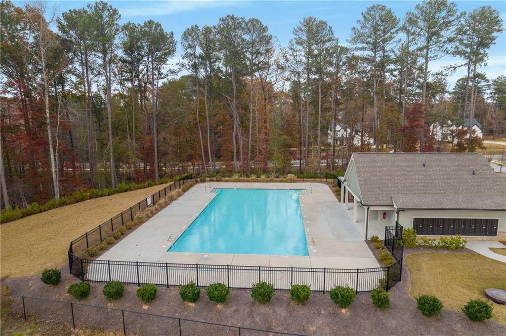 338 Ryston Way Grayson, GA 30017 - Photo 58 of 61 a view of a swimming pool with a patio and a yard