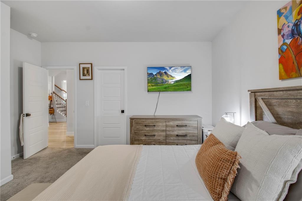 338 Ryston Way Grayson, GA 30017 - Photo 8 of 61 a bedroom with a bed and furniture