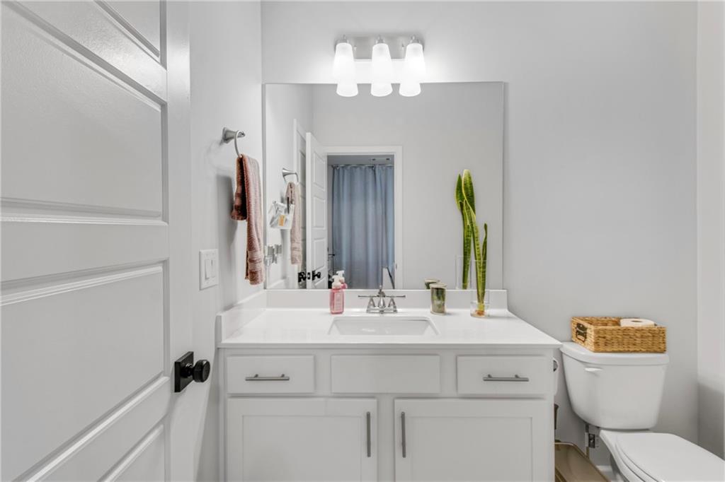 338 Ryston Way Grayson, GA 30017 - Photo 10 of 61 a bathroom with a sink vanity mirror and toilet