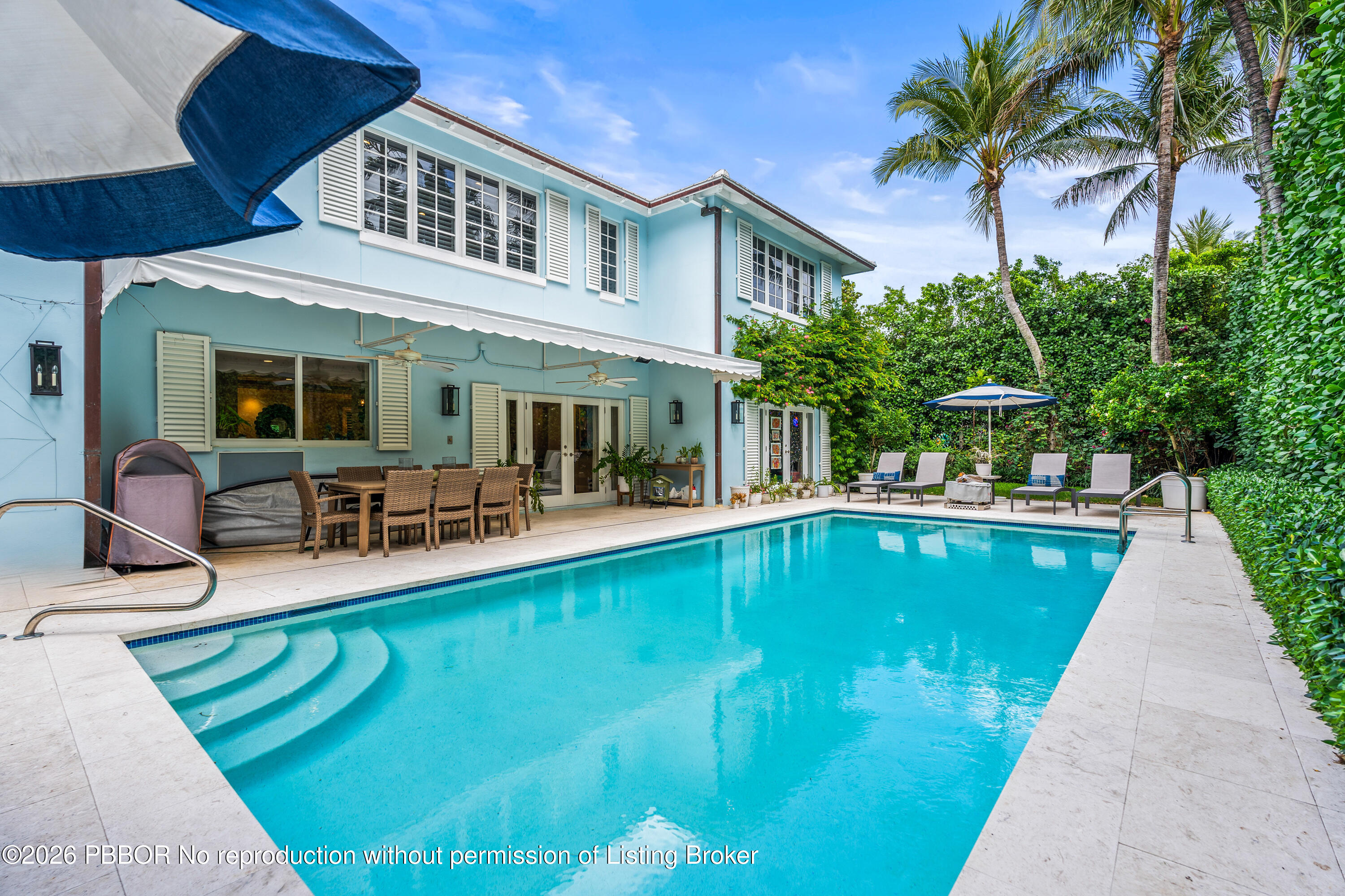 156 Dolphin Road Palm Beach, FL 33480 - Photo 15 of 21 a view of a house with swimming pool and sitting area