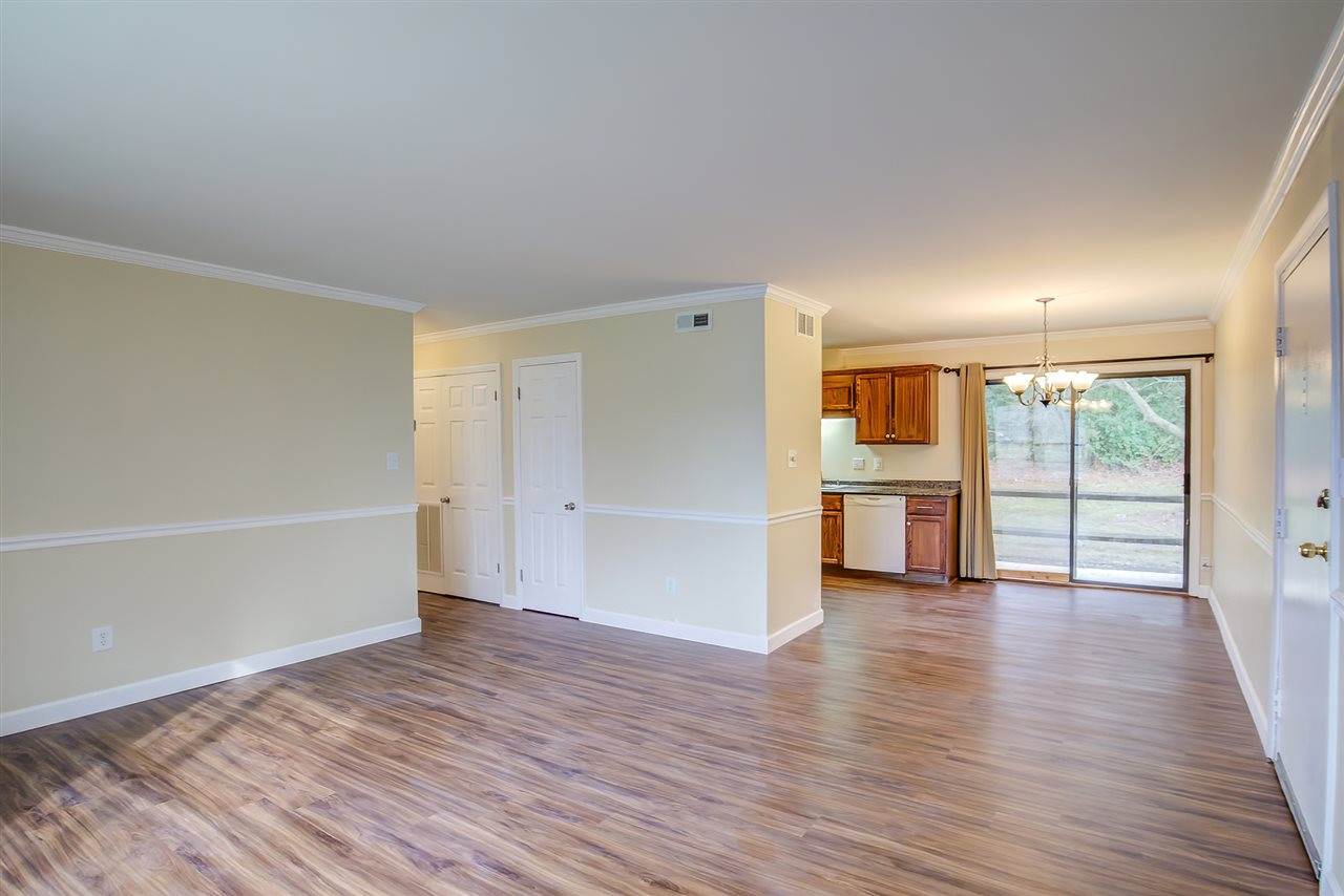 5608 Falls Of Neuse Road, Unit E Raleigh, NC 27609 - Photo 6 of 28 Looking into Kitchen & Dining Area; Hallway to BedRoom/Baths on left Living Area