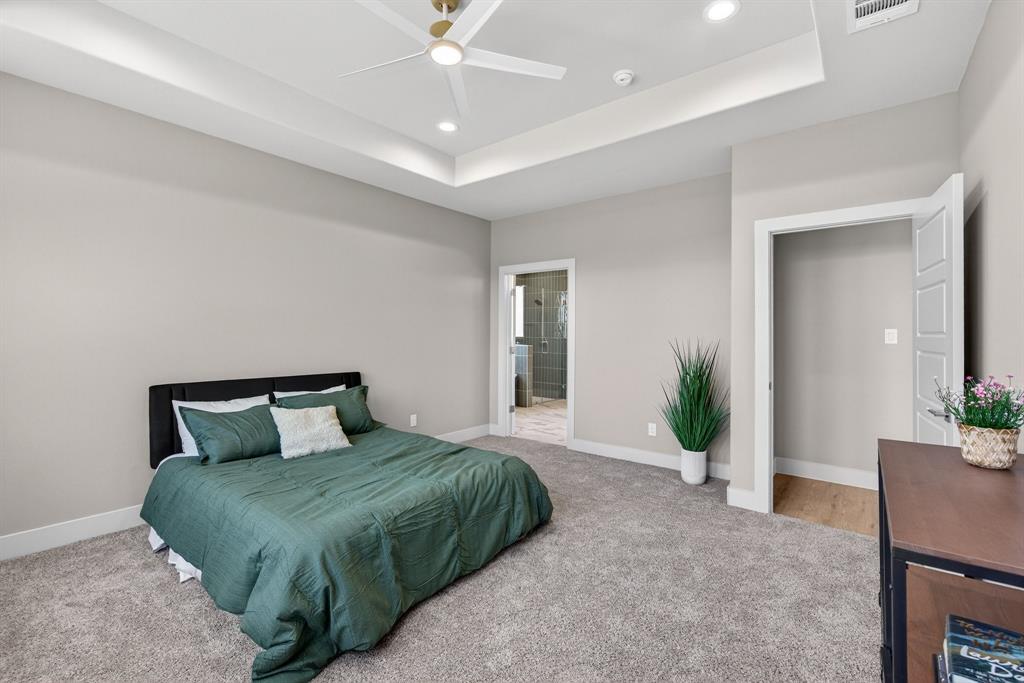 900 Cope Street Mansfield, TX 76065 - Photo 20 of 37 a bedroom with a large bed and a potted plant
