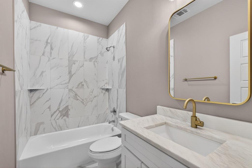 900 Cope Street Mansfield, TX 76065 - Photo 30 of 37 a bathroom with a granite countertop sink toilet and shower