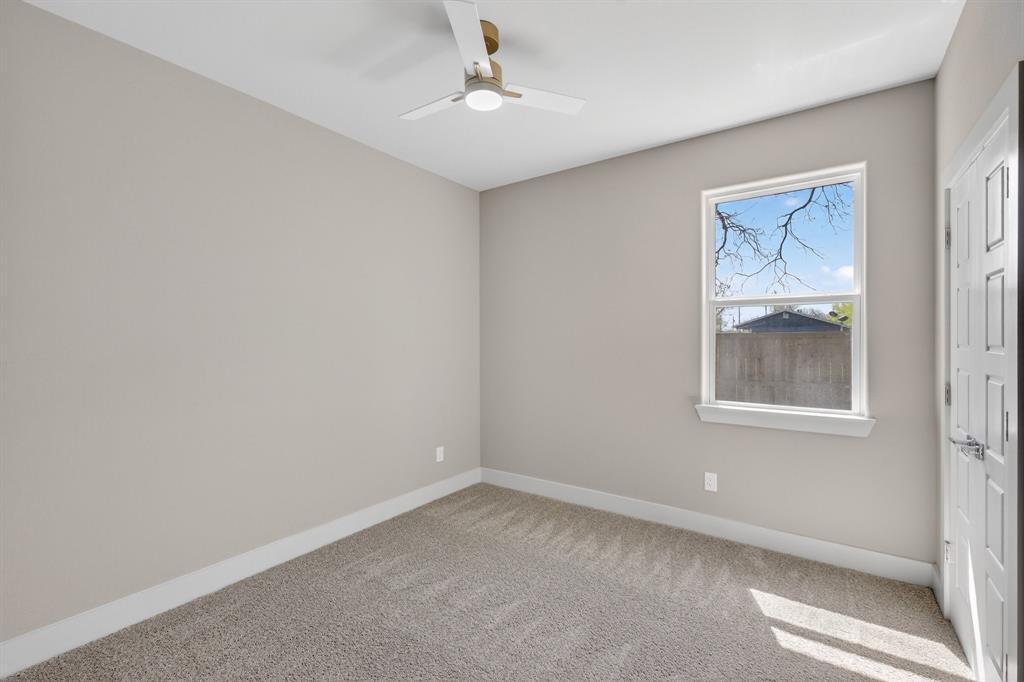 900 Cope Street Mansfield, TX 76065 - Photo 32 of 37 an empty room with a window and a ceiling fan