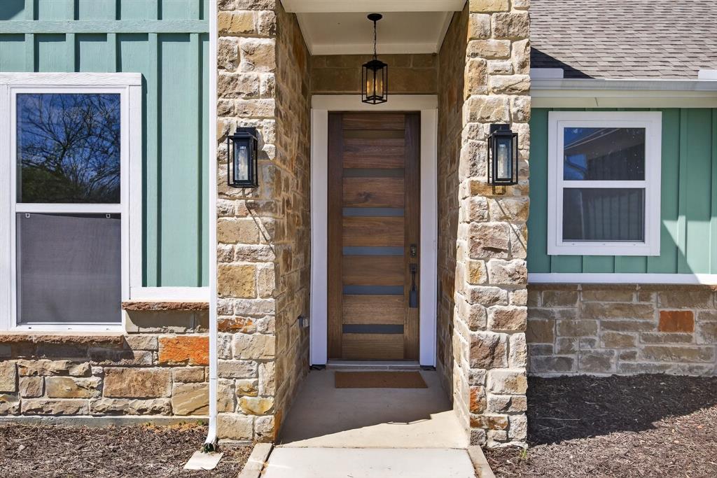 900 Cope Street Mansfield, TX 76065 - Photo 4 of 37 a front view of a house with a glass door