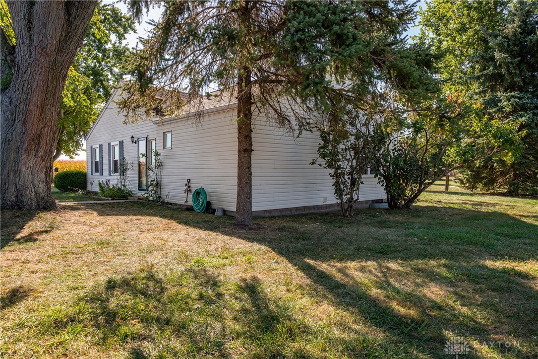1599 Garringer Road Jamestown, OH 45335 - Photo 49 of 73 This charming home sits amidst mature trees, offering a serene escape.