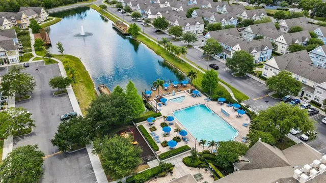 an aerial view of a house a yard and a swimming pool