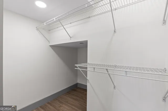 a backyard of a house with swimming pool table and chairs