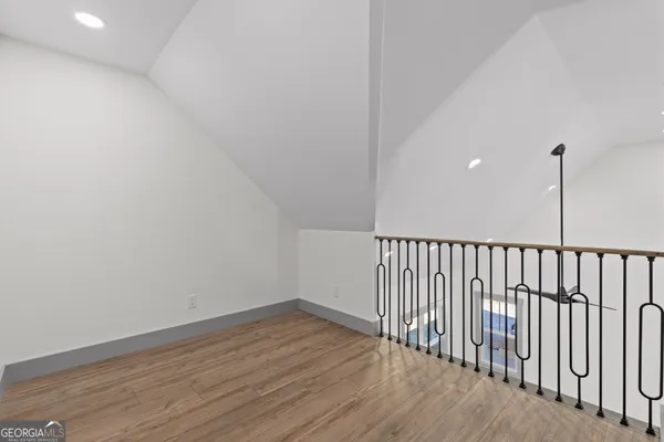 a view of balcony with wooden floor and fence