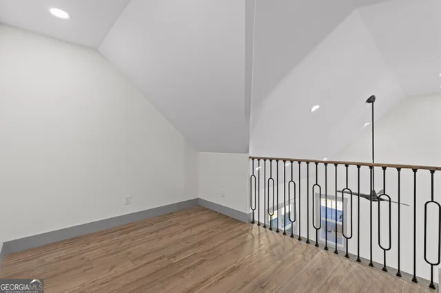 a view of balcony with wooden floor and fence