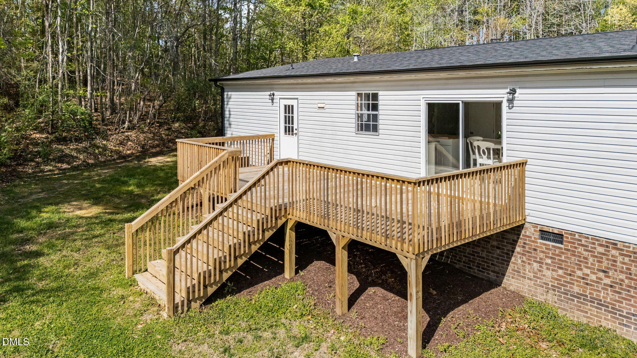 721 General Green Road Kittrell, NC 27544 - Photo 30 of 36 a view of a house with a wooden deck