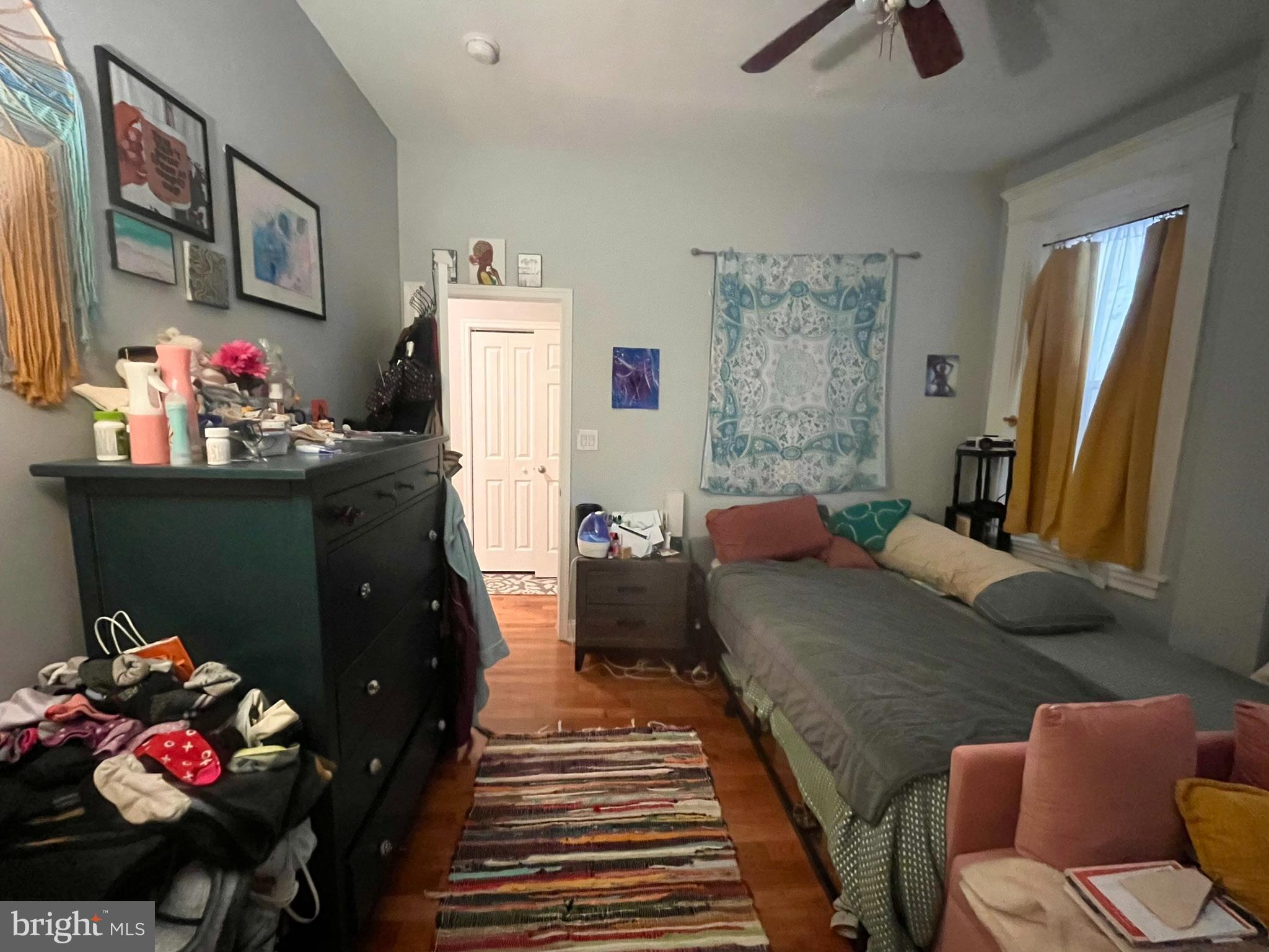 5028 Walnut Street, Unit 1F Philadelphia, PA 19139 - Photo 20 of 32 a living room with furniture and a couch
