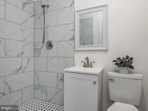 a bathroom with a sink toilet and vanity