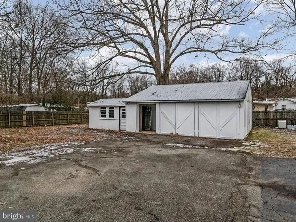 a view of a house with a yard and garage