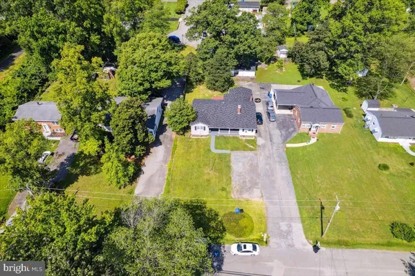 an aerial view of a house with swimming pool