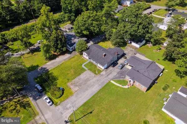 an aerial view of a house with a swimming pool