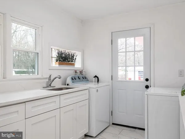 a bathroom with a sink and a window
