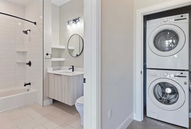 a bathroom with a sink a mirror and a bathtub