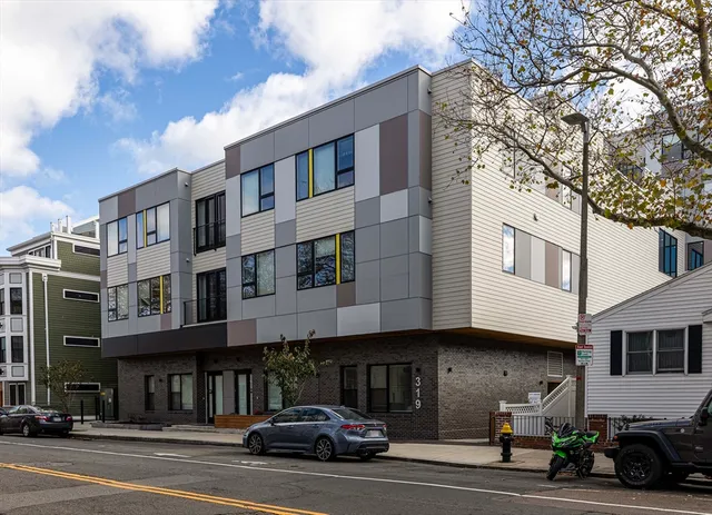 a view of a car parked in front of a building