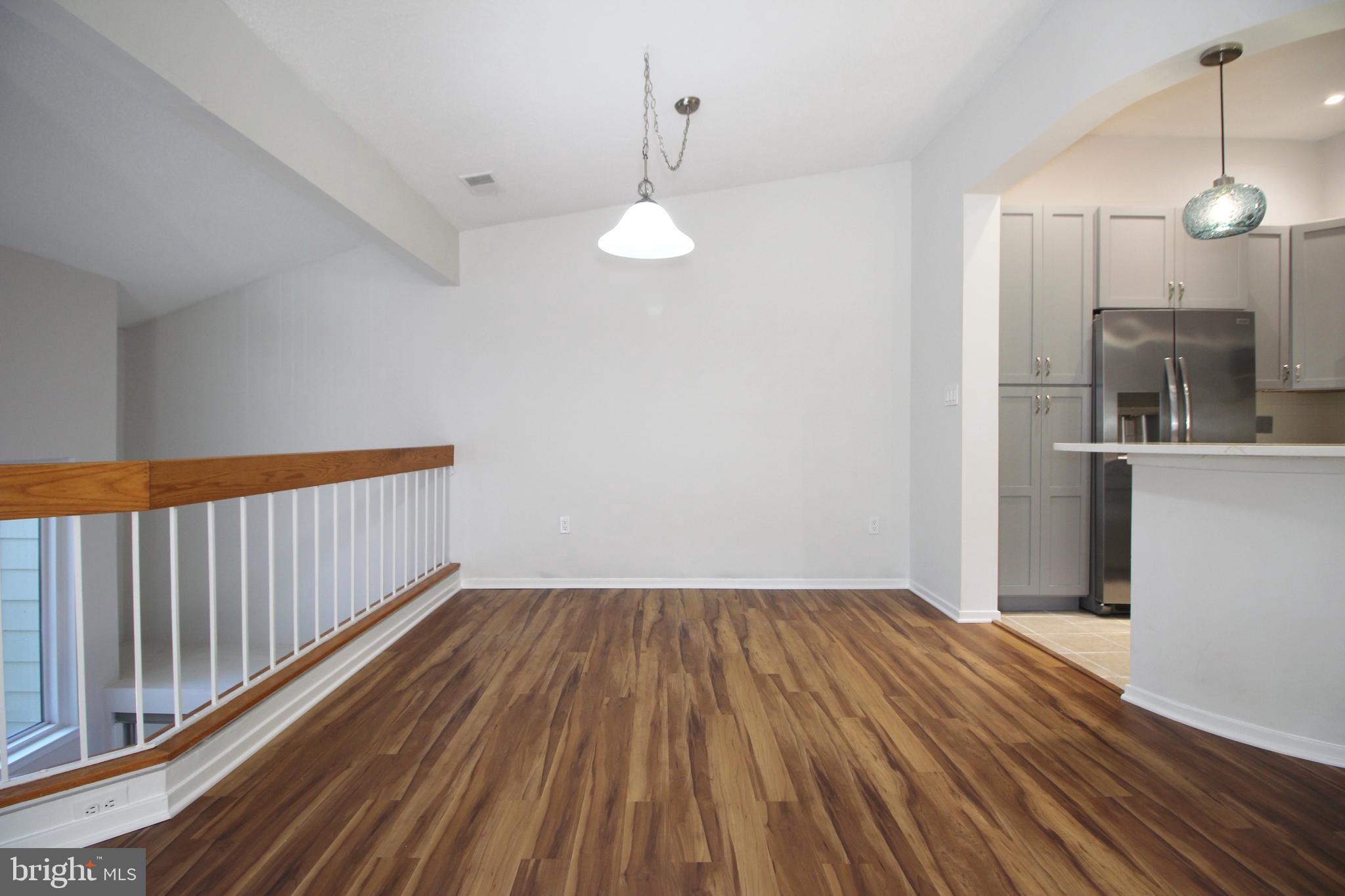 1956A Villaridge Drive, Unit 1956B Reston, VA 20191 - Photo 13 of 24 a view of empty room with wooden floor