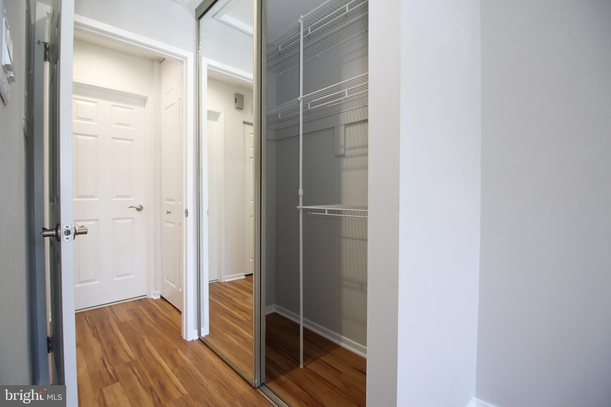 1956A Villaridge Drive, Unit 1956B Reston, VA 20191 - Photo 19 of 24 a view of walk in closet with wooden floor