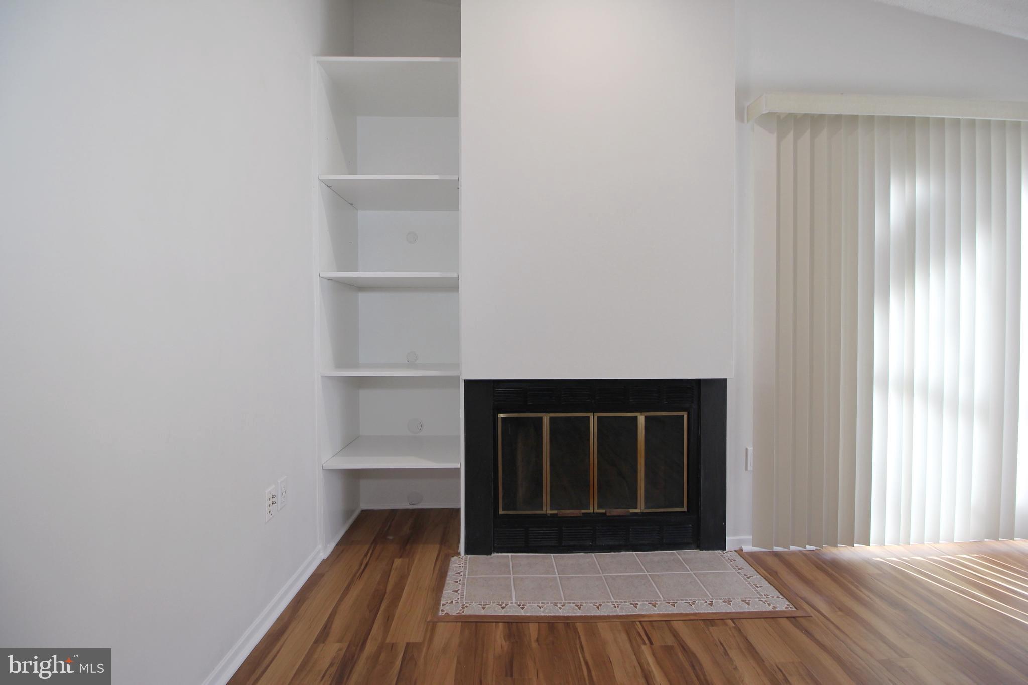 1956A Villaridge Drive, Unit 1956B Reston, VA 20191 - Photo 6 of 24 a view of a room with wooden floor and a window