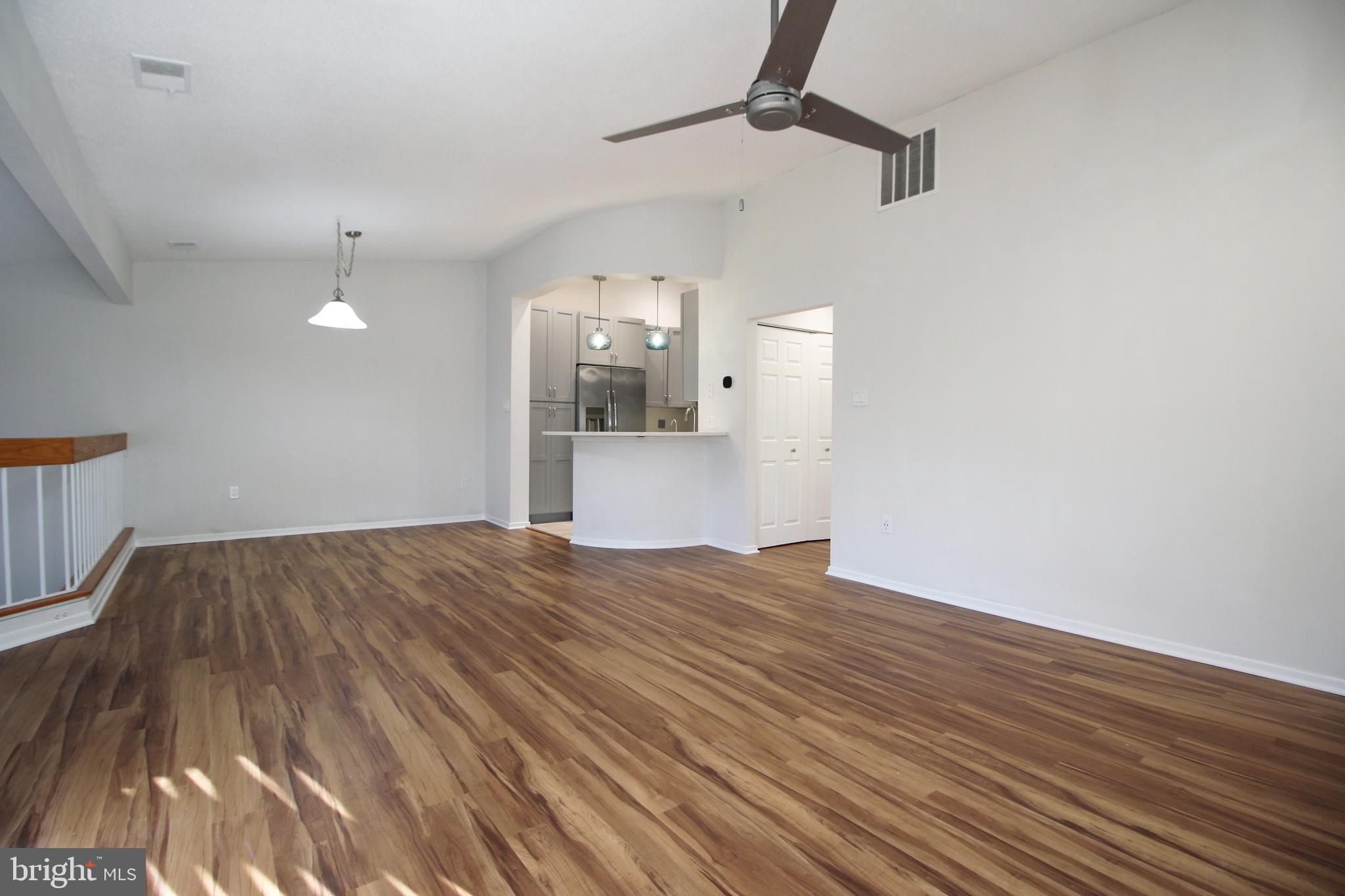 1956A Villaridge Drive, Unit 1956B Reston, VA 20191 - Photo 8 of 24 a view of empty room with wooden floor and fan