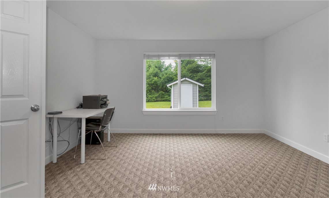 8801 178th Avenue Southwest Rochester, WA 98579 - Photo 3 of 39 an empty room with a window