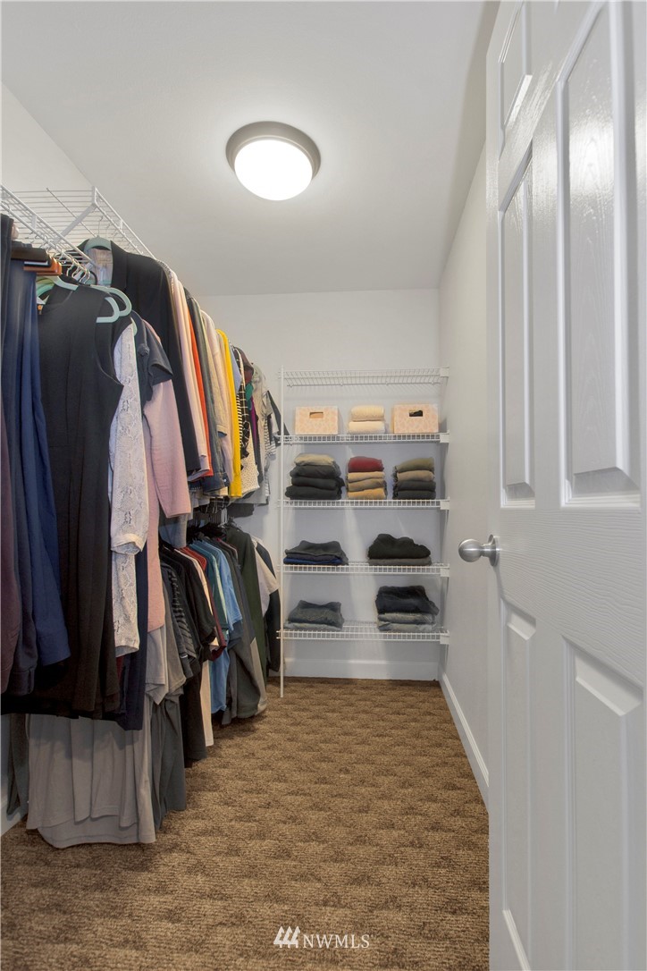 8801 178th Avenue Southwest Rochester, WA 98579 - Photo 33 of 39 a view of walk in closet with clothes and shoes