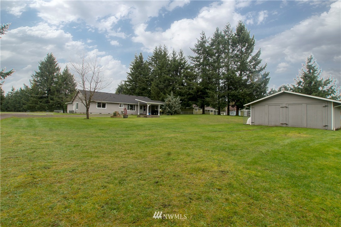 8801 178th Avenue Southwest Rochester, WA 98579 - Photo 36 of 39 a view of a house with a yard