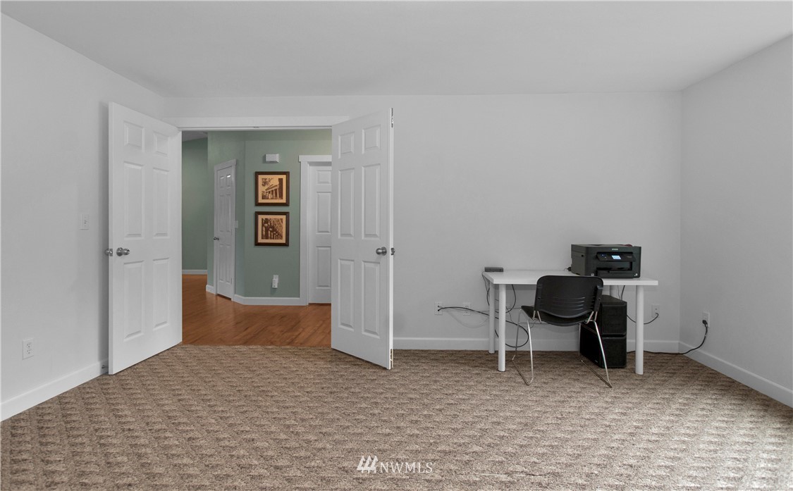 8801 178th Avenue Southwest Rochester, WA 98579 - Photo 5 of 39 a bedroom with a chair and a desk
