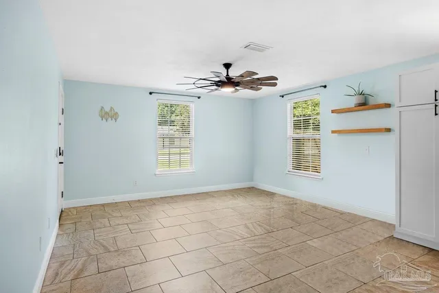 a view of an empty room with a window