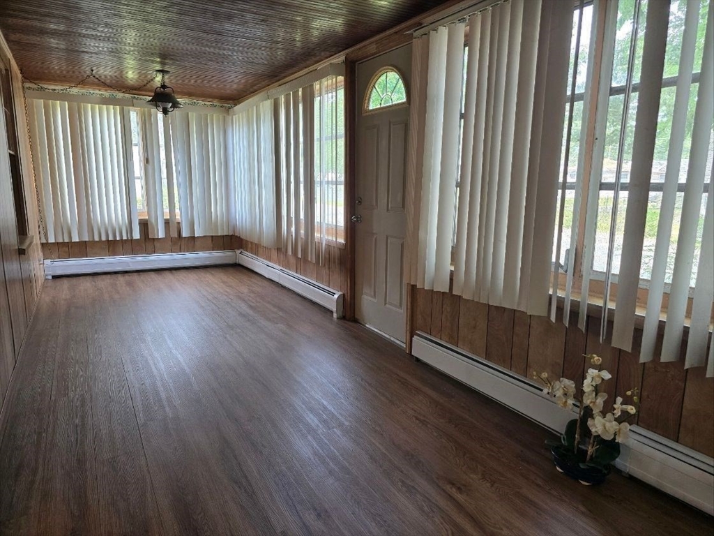 43 Shore Avenue Wareham, MA 02571 - Photo 11 of 32 an empty room with wooden floor and windows